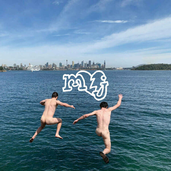Two people jumping into a lake